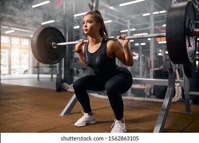 Beautiful Sporty Weightlifter Holding Heavy Metal Professional Barbell, Preparing To Stand And Make Exercise Called Deadlift, Side Shot, Portrait