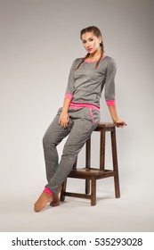 Beautiful Sporty Woman In Gray Sweatsuit
