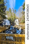 A beautiful spring landscape at Anna Ruby Falls with running water, rocks and lush green trees and plants in Unicoi State Park in Helen Georgia USA