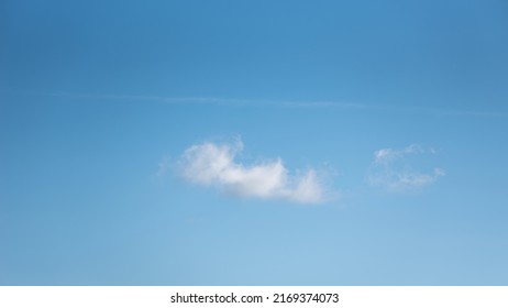 Beautiful Spring Landscape White Single Cloud In Clear Blue Sky Colorful Vibrant Skyscape Background Image