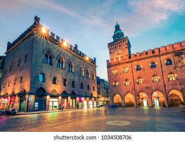 Beautiful spring sunset on main square of City of Bologna with Palazzo d'Accursio and facade of Basilica di San Petronio. Great cityscape of Bologna, Italy, Europe. Traveling concept background.