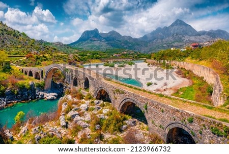 Beautiful spring view of Old Mes Bridge. Colorful morning landscape of Shkoder. Amazing outdoor scene of Albania, Europe. Traveling concept background. Foto stock © 