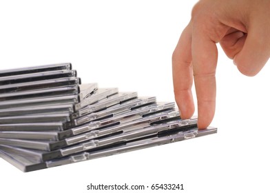 Beautiful stack of disc cases and fingers isolated on white background