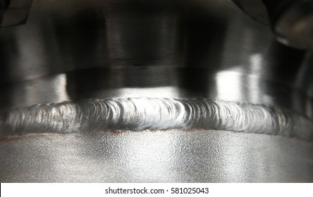 Beautiful stainless weld line from flange connecting pipe to pipe by experience welder