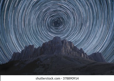 Beautiful Star Trails Over The Rocky Mountains. Polar North Star At The Center Of Rotation.