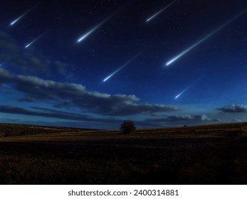 Beautiful starfall in the twilight sky. A stream of meteors reached the Earth. Meteorites glow over the fields. Sci-fi landscape.
