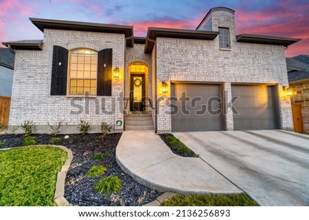 A beautiful stone home at sunset
