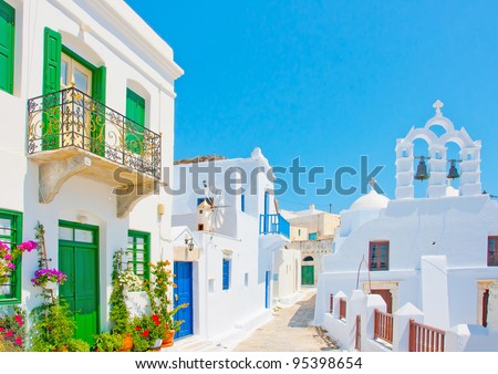 Beautiful stone made road with old traditional houses and a twin church in Chora the capital of Amorgos island in Greece