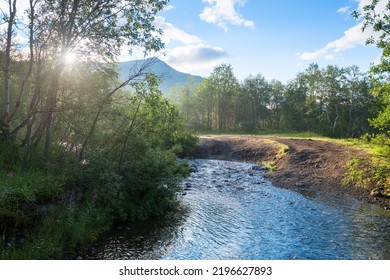 Beautiful Stormy Mountain River Of Emerald And Blue Hues Runs Over Rocks Top View