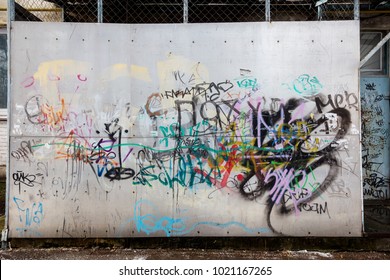 Beautiful street art. Abstract creative drawings of fashionable colors on the walls of the city. Urban contemporary culture. Abstract stylish drawing, label on the wall, fragment of graffiti