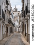 Beautiful street in the medieval town of Alburquerque (Extremadura) with old houses, some of them made of stone and full of balconies. One of the most beautiful villages in Extremadura. 