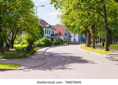 beautiful street with modern residential houses in summer sunny day