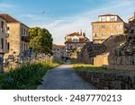 Beautiful streets of Pontevedra City. Galician houses with flowers at balconies. Small streets. Famous travel destination in Galicia, Spain. 