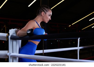 Beautiful And Strong Sportswoman Posing In The Corner Of The Ring. The Concept Of Wrestling And Boxing. Mixed Media