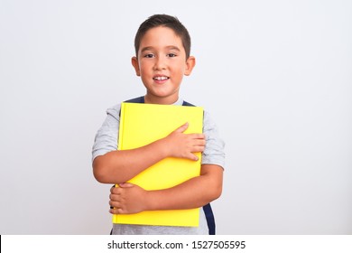 Beautiful Student Kid Boy Wearing Backpack Holding Book Over Isolated White Background With A Happy Face Standing And Smiling With A Confident Smile Showing Teeth