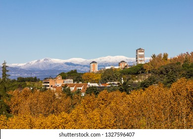 Beautiful Stunning Vista With Clear Skies And Mountains In The Background Behind Urban Madrid