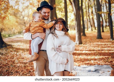 Beautiful And Stylish Family In A Park