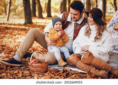 Beautiful and stylish family in a park