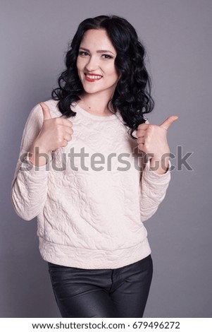 beautiful stylish girl shows fingers
