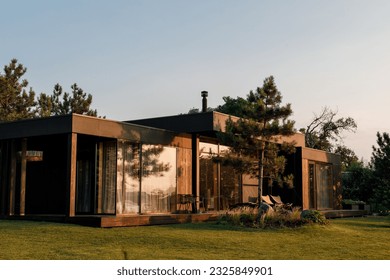 A beautiful stylish house with a beautiful landscape and territory