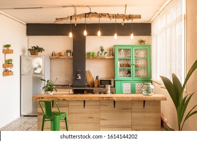 Beautiful, Stylish And Open Bright Kitchen With Wooden Kitchen Island, Green Cabinet And Big Windows. Home Design.