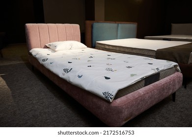 Beautiful Stylish Single Bed For A Baby Girl Upholstered In Pink Pastel Velour Fabric Displayed For Sale In A Furniture Showroom. Home Interior Design Concept. Home Design, Bedroom, Healthy Sleep