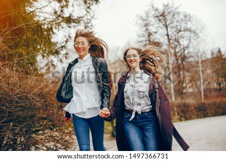 Similar – Frauenfreunde lachend bei Spaziergängen im Wald