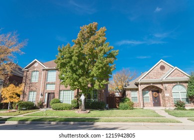 Beautiful Suburban Dallas, Texas Home Autumn Day Residential Neighborhood. Colorful Fall Foliage In North America With Cloud Blue Sky