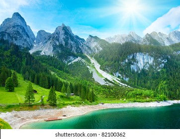 Beautiful summer Alpine mountain lake Gosausee view and sunshine in sky. Austria Alps. Beautiful natural vacation hiking walking travel to nature destinations concept. - Powered by Shutterstock