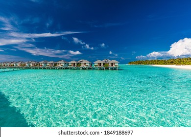 Beautiful summer beach paradise with sandy beach and villas and lagoon