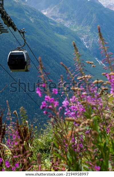 Beautiful summer mountain\
landscape with cable car. Dombai, Karachay-Cherkessia,\
Russia