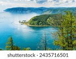 Beautiful summer panoramic landscape with view from Chersky stone to lake Baikal shore and Angara source. Listvyanka village at Baikal lake coast. Amazing siberian nature. Siberia, Russia