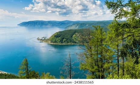 Beautiful summer panoramic landscape with view from Chersky stone to lake Baikal shore and Angara source. Listvyanka village at Baikal lake coast. Amazing siberian nature. Siberia, Russia - Powered by Shutterstock