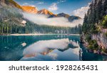 Beautiful summer scenery. Foggy morning view of Braies (Pragser Wildsee) lake. Splendid summer scene of Fanes-Sennes-Braies national park, Dolomiti Alps, South Tyrol, Italy, Europe. 