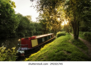 Beautiful Summer sunrise landscape of barge long boat on canal