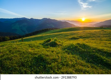Beautiful summer sunrise in mountains. Path along the ridge leading to summit - Shutterstock ID 291388793