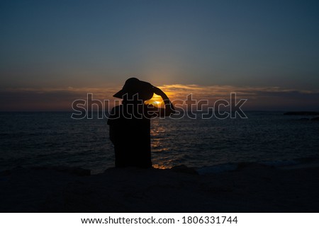 Similar – A girl from the 2019 Queensland National Team watches the sunset in Adelaide.