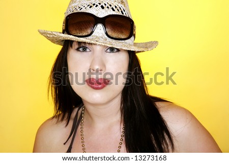 beautiful summer woman with sunglasses and a hat