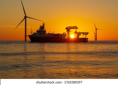 Beautiful sun set in the North Sea offshore wind farm