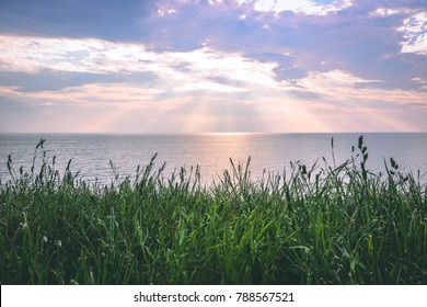 Beautiful Sun Set Over Lake Huron: Grand Bend Ontario Canada: Stunning views of The Lake with Rays of Sun and Clouds  - Shutterstock ID 788567521