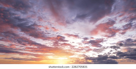 Beautiful sun shines brightly on the clouds in a bright red color in the evening, Sky background. - Shutterstock ID 2282705831