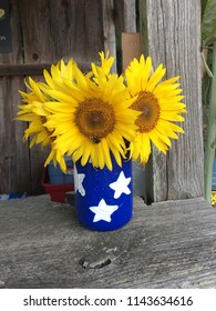 Beautiful Sunflowers In A Blue And Star Painted Mason Jar 