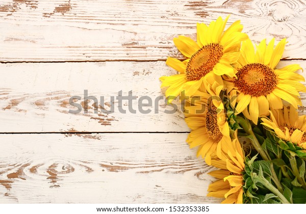 Beautiful Sunflowers On White Wooden Background Stock Photo 1532353385 ...