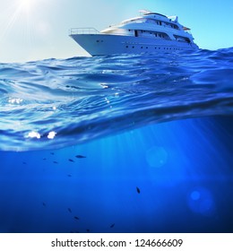 Beautiful Sunlight Seaview Safari Dive Boat In Tropical Sea With Deep Blue Underneath Splitted By Waterline. Design Template