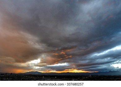 Beautiful Sunlit Storm Clouds Over City Lights