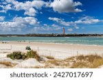 Beautiful Sunny beach and Lighthouse Ponce de Leon Inlet from New Smyrna beach, Florida.