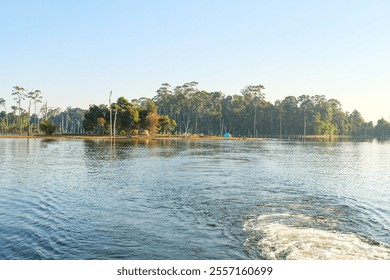 Beautiful sunny camping day, a clear blue sky over Nakai reservoir lake at Thalang, Nakai Plateau, Laos  - Powered by Shutterstock