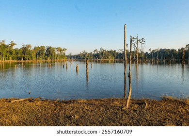 Beautiful sunny camping day, a clear blue sky over Nakai reservoir lake at Thalang, Nakai Plateau, Laos  - Powered by Shutterstock