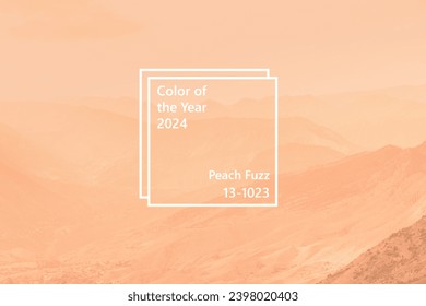 Beautiful sunny day in mountain valley and mountainous countryside landscape in summer toned in pantone color of year 2024 Peach Fuzz Stock Photo