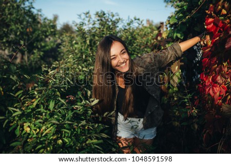 beautiful sunny portrait of a girl. Laughing girl's face in the park